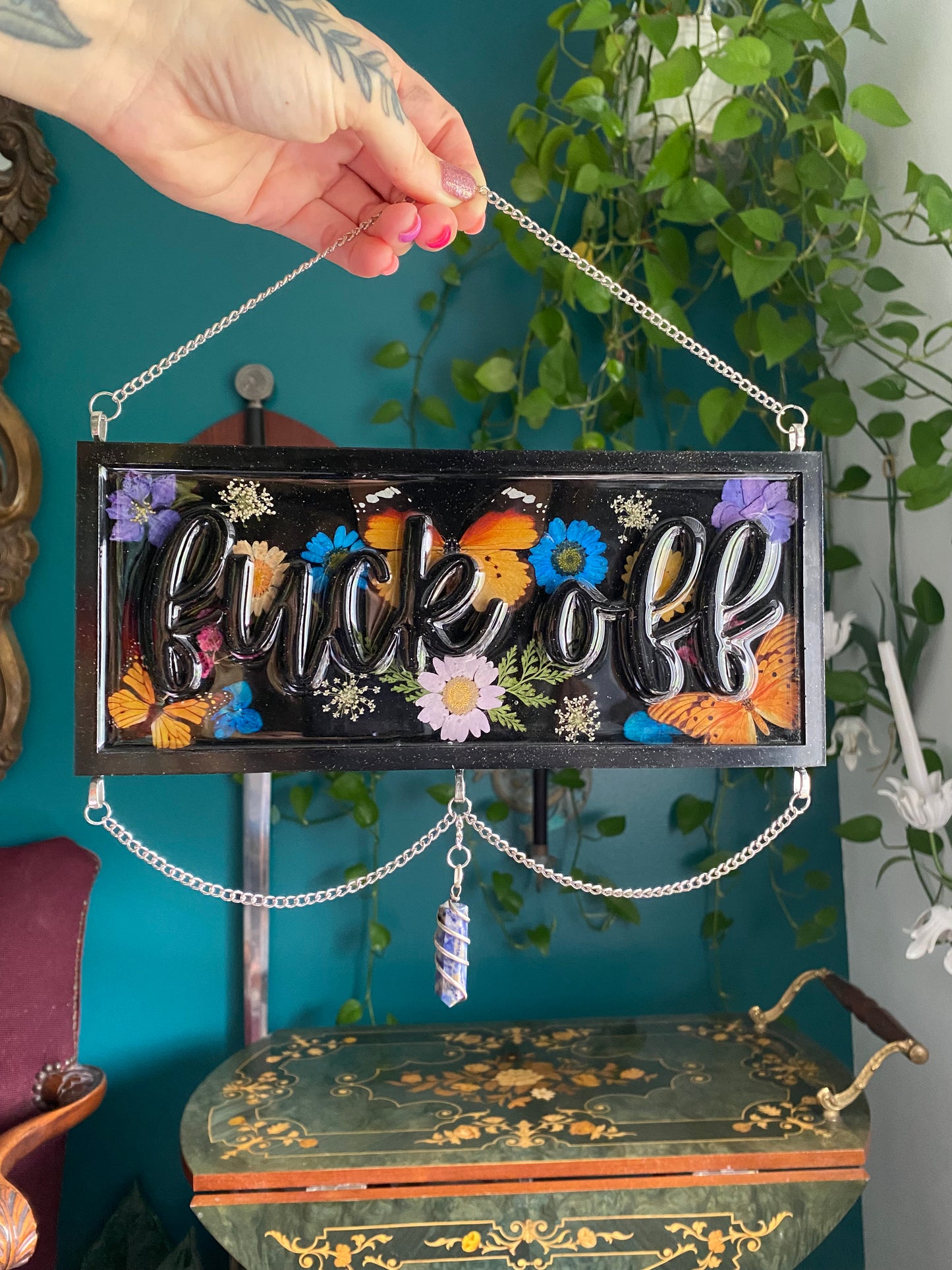 Black floral “fuck off” sign with sodalite